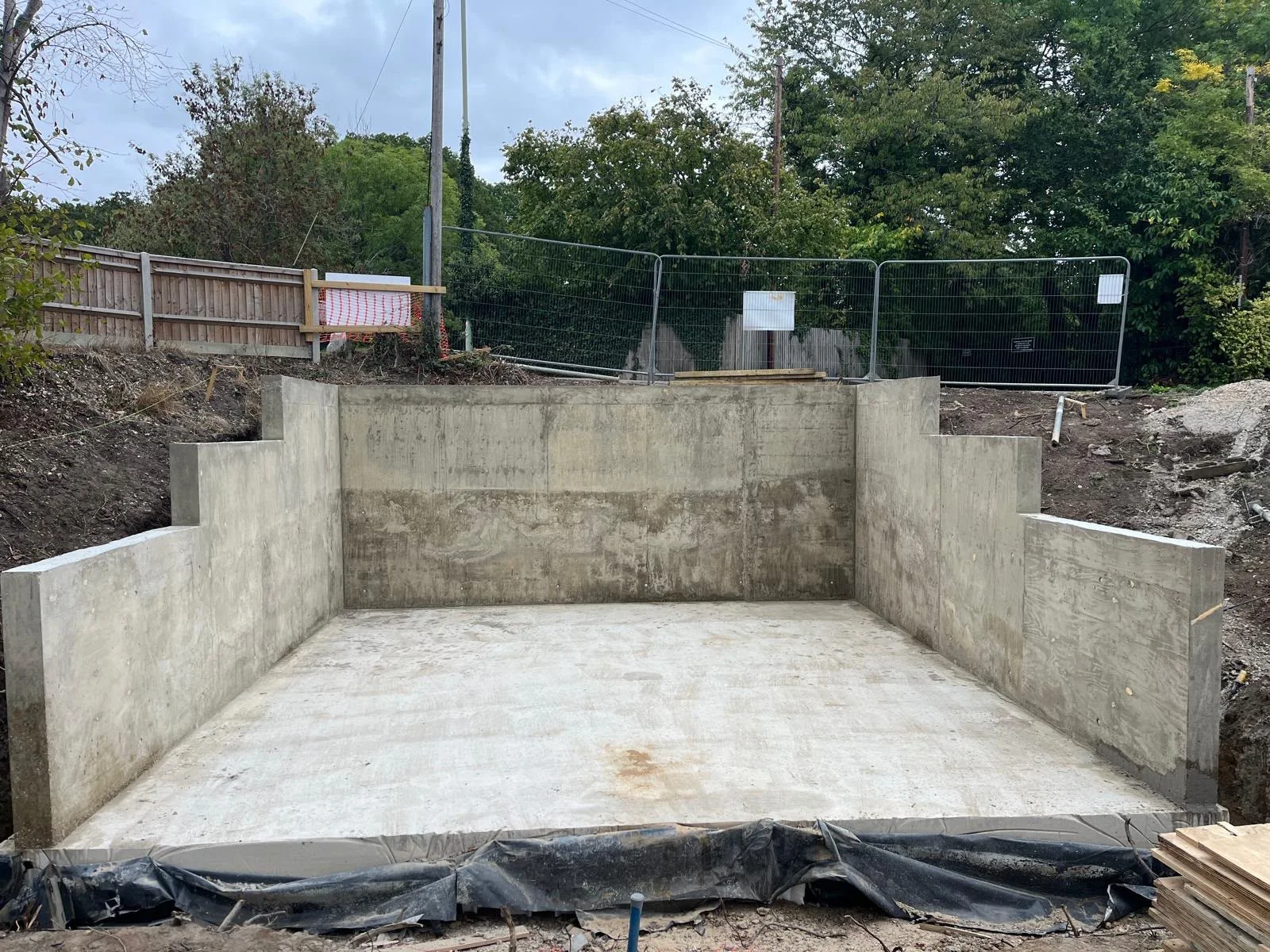 Finished fair-faced reinforced concrete box with stepped retaining walls, front view